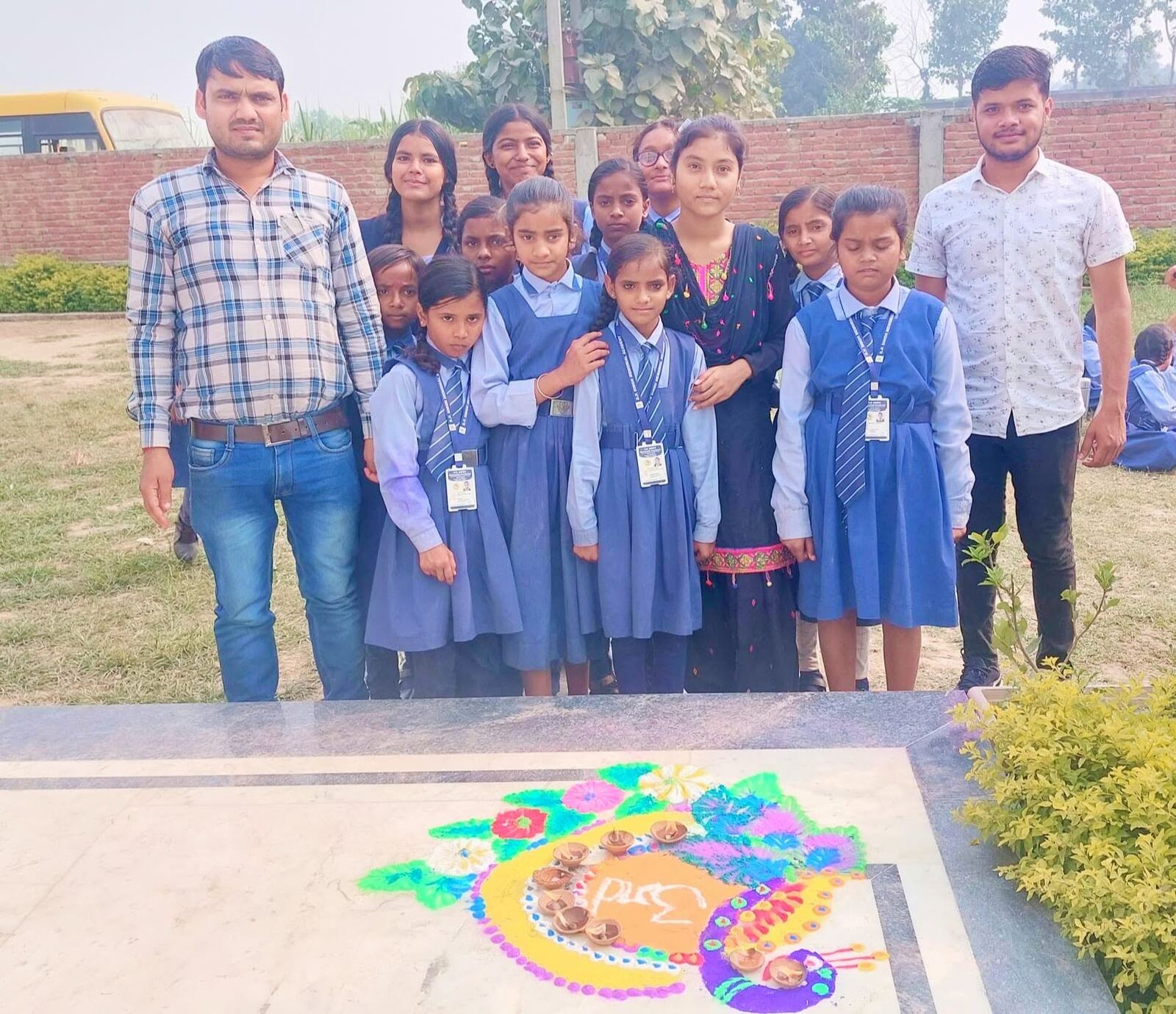 Teachers and staff celebrating Diwali with students